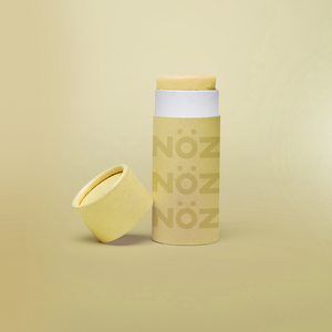 Yellow NÖZ container sitting open with the top off.