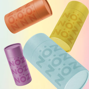 Orange, yellow, blue, and purple NÖZ containers floating at angles